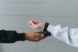 A person is paying with their smart watch