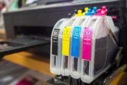 Epson ink cartridges in a printer.
