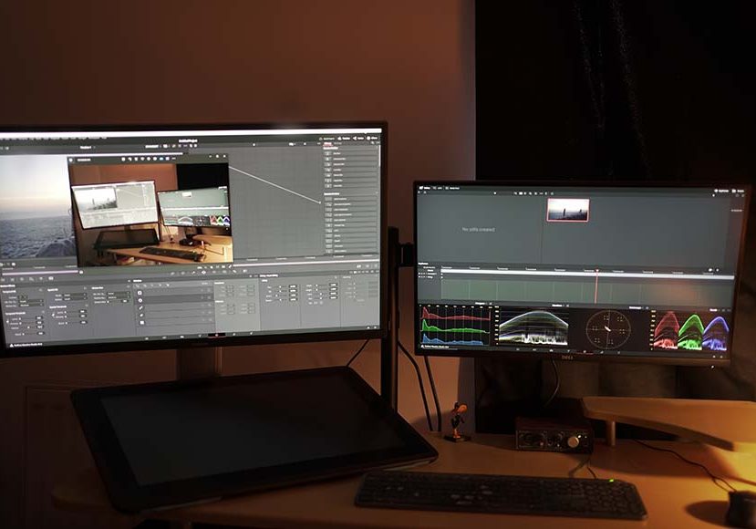 A desk with two monitors and a mouse. A desk with two monitors and a mouse.