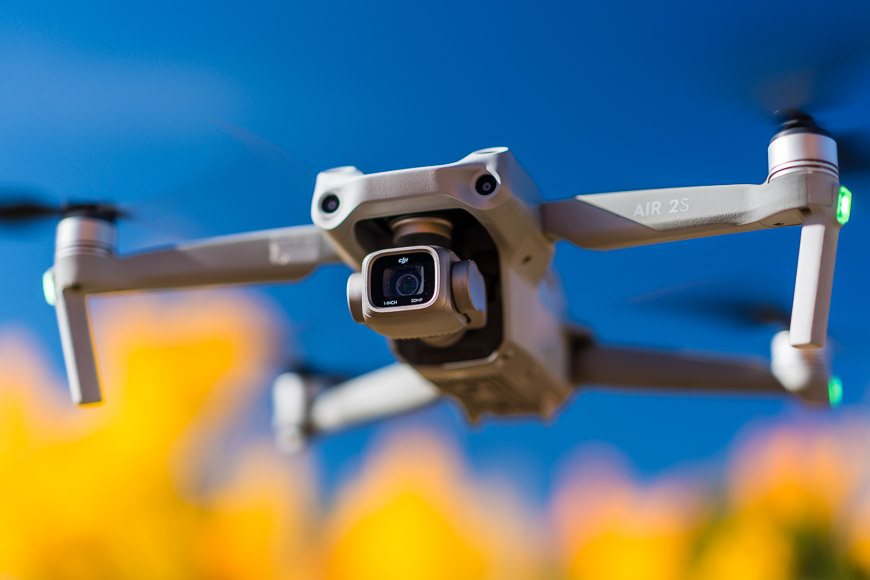 A dji mavic drone flying in the sky.