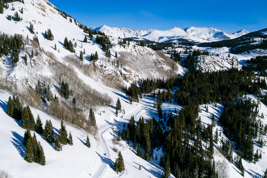 An aerial view of a snow covered mountain.