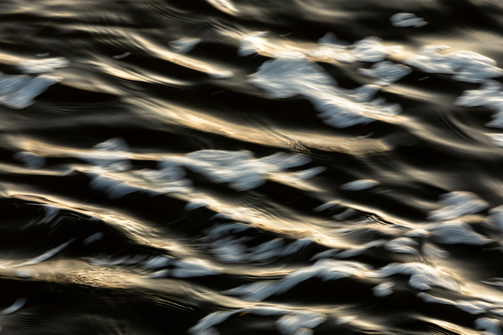 A close up of a wave in the water.