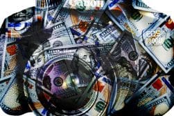 An image of a camera surrounded by money.