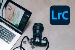 A laptop with the word lrc on it next to a camera.