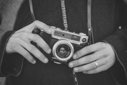 a person holding a camera in their hands.