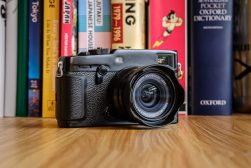 a camera sitting on top of a wooden table.