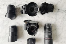 a table topped with different types of cameras.
