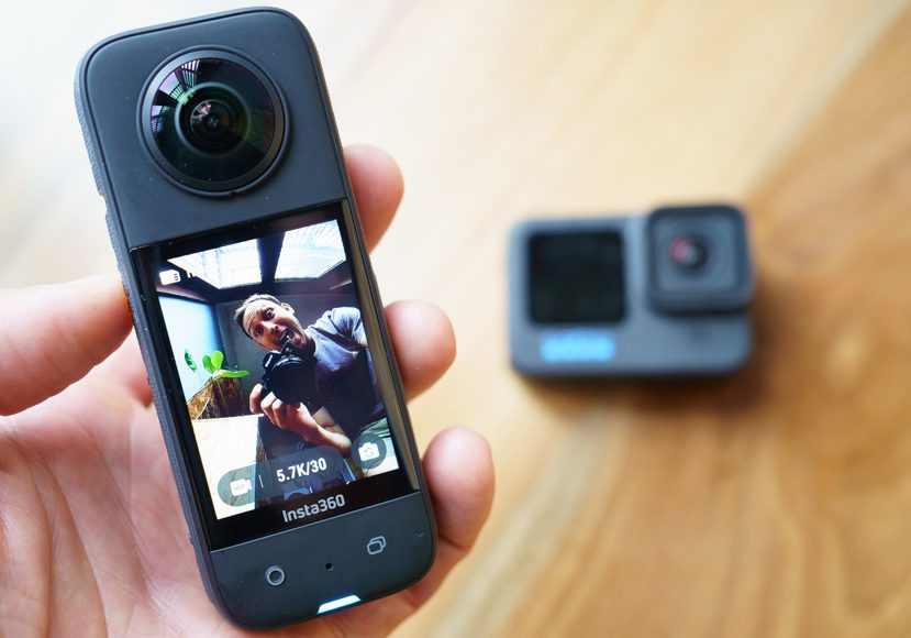 insta360 a person holding an insta360 x3 action camera in their hand.