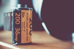 A roll of film sitting on a wooden table.