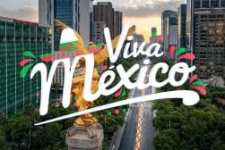 The word 'viva mexico' is in the background of a city.