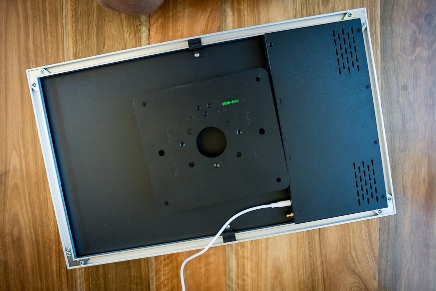 A rectangular object with a white wire.