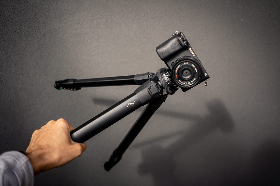 travel tripod by peak design being held in hand