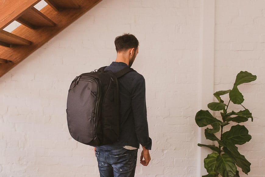 travel bag day pack with waist straps and nylon cancas and side access / side pockets