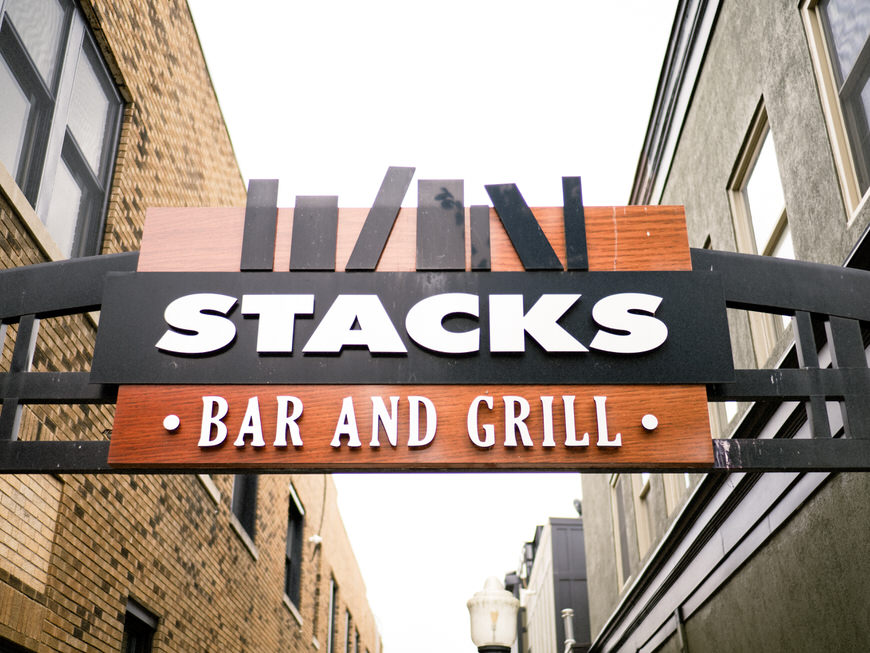 A sign that says stacks bar and grill.