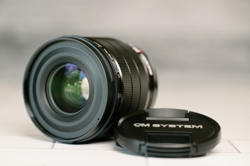 An image of a camera lens with a lens cap on it.