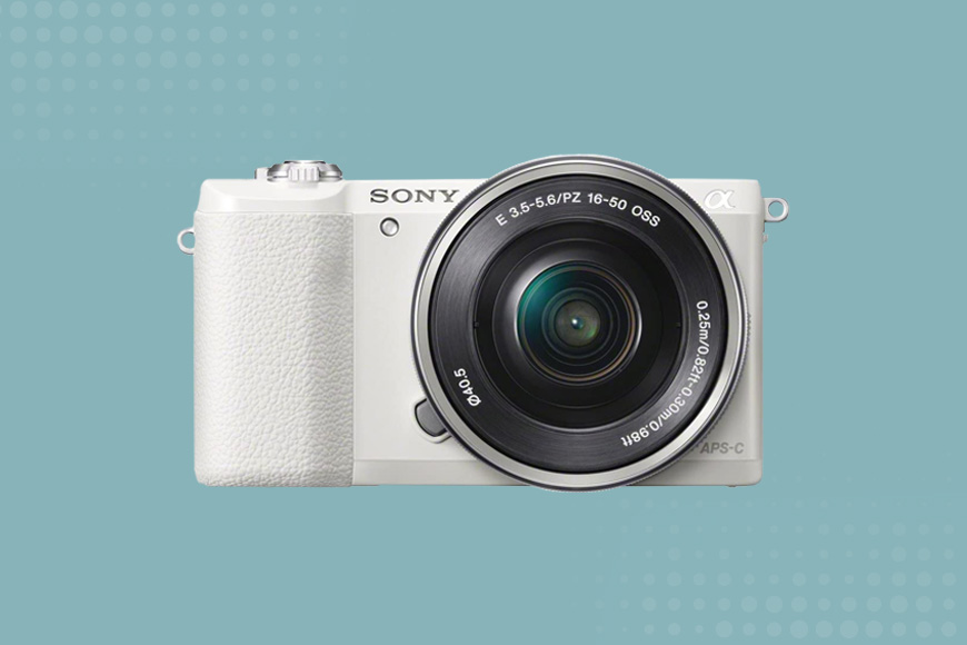 a white camera on a blue background