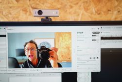a man taking a picture of himself on a computer screen.