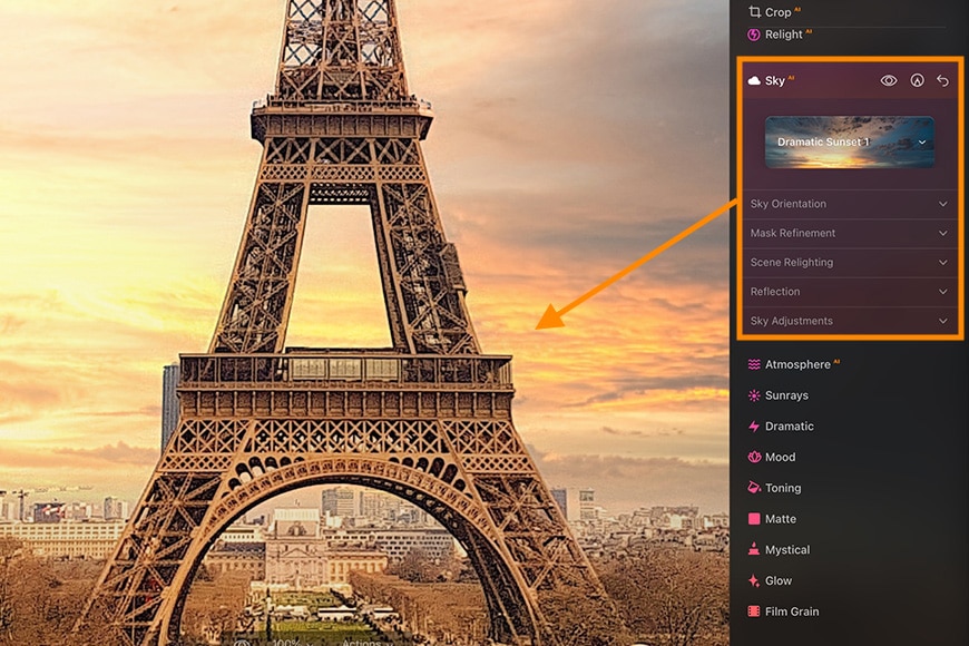 Close-up of Eiffel Tower showing sunset through beams
