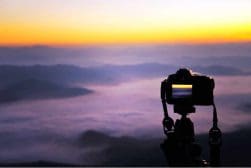 Shooting a time lapse of the sunset in top if a mountain.