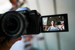 A person is holding a camera and taking a picture.