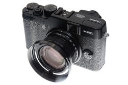 A black fuji x20 camera with a lens attached to it.