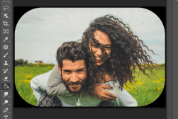 A photo of a man and a woman in a field.