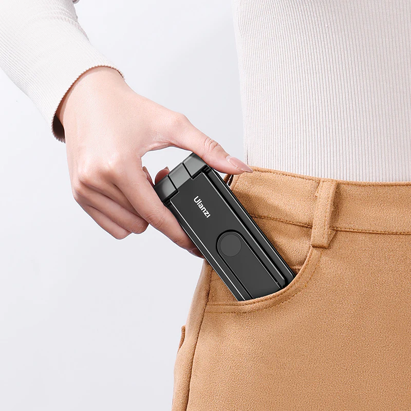 A person holding a device in their pocket.