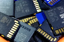 A bunch of sd cards in a basket.